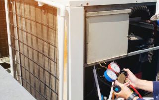 Technician working on a HVAC unit